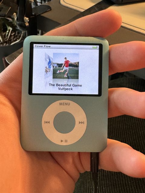 Photograph of an iPod nano 3rd gen showing album artwork in cover flow