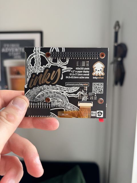 Photo of the back of the pimoroni eink hat for raspberry pi. The PCB has a gorgeous octopus illustration on it.