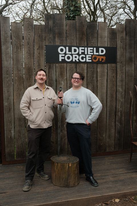 Photo of my and my boyfriend holding the sword we made