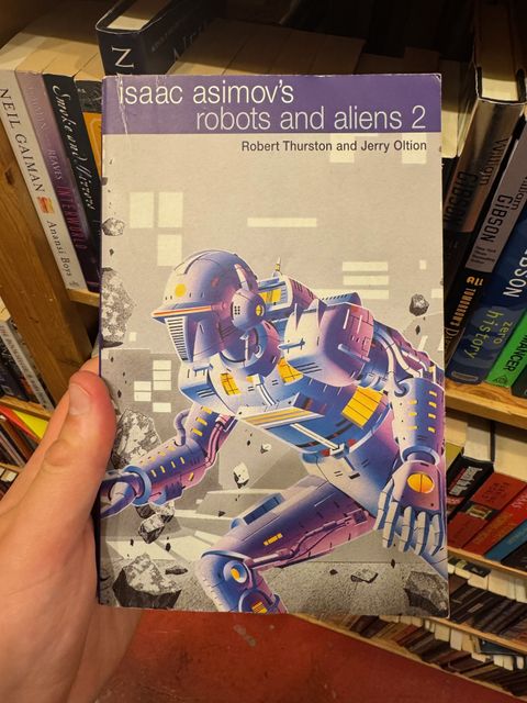 A 90s edition Isaac Asimov Foundation book with Fred Gambino cover art.