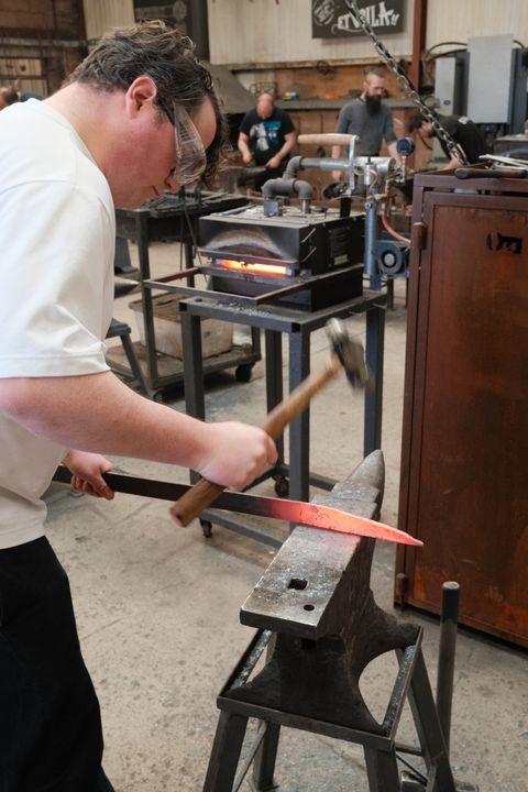 Photo of me in a forge adding a point to our steel