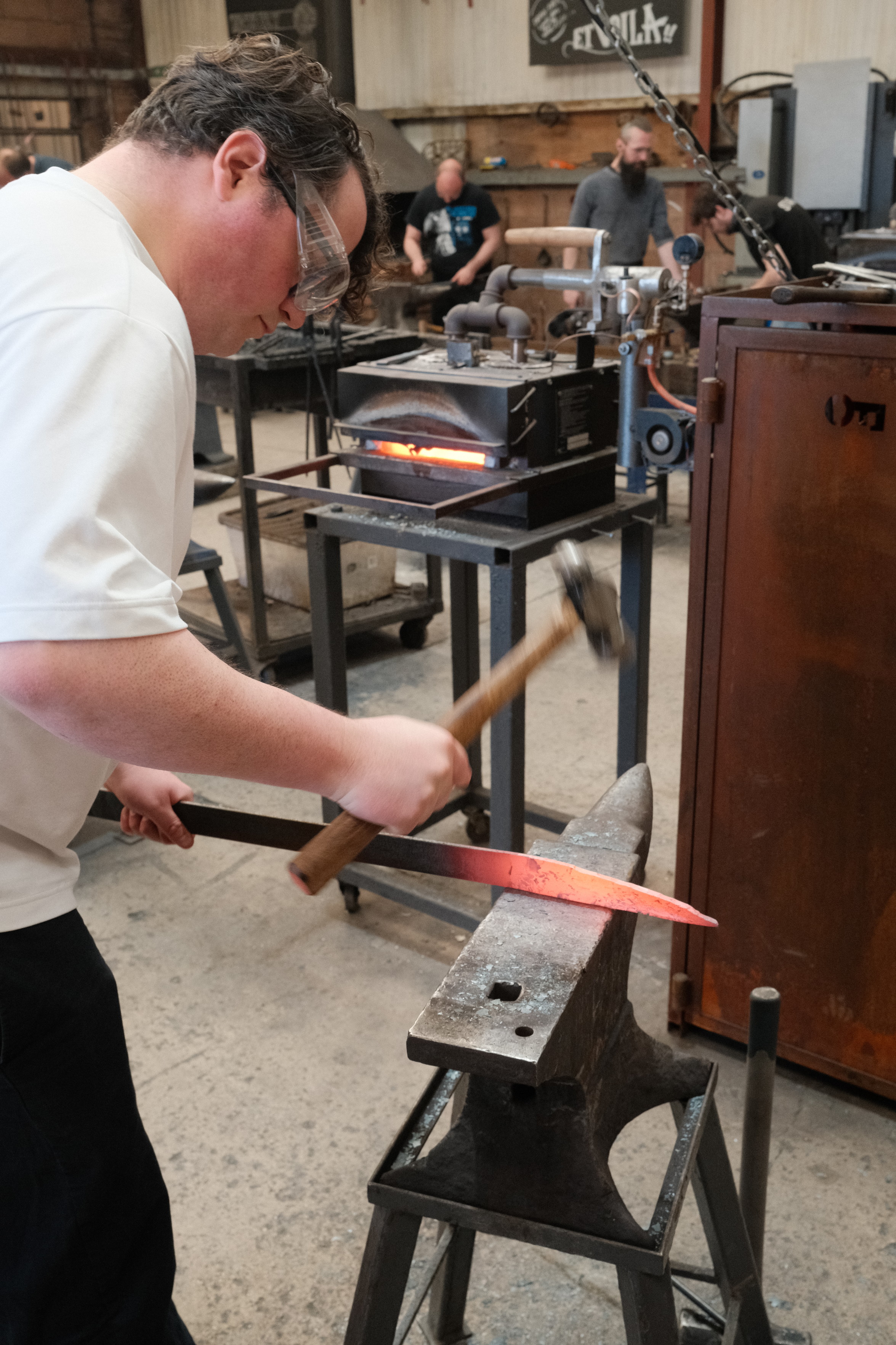 Photo of me in a forge adding a point to our steel